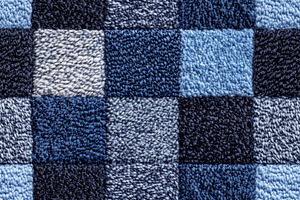 Seamless carpet textured fabric featuring a checkered pattern in various shades, a Texture Graphic by Textures & Backgrounds