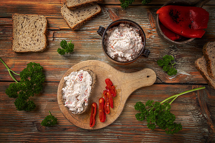 Delicious creamy spread with roasted red peppers, a Photo by Grafvision photography