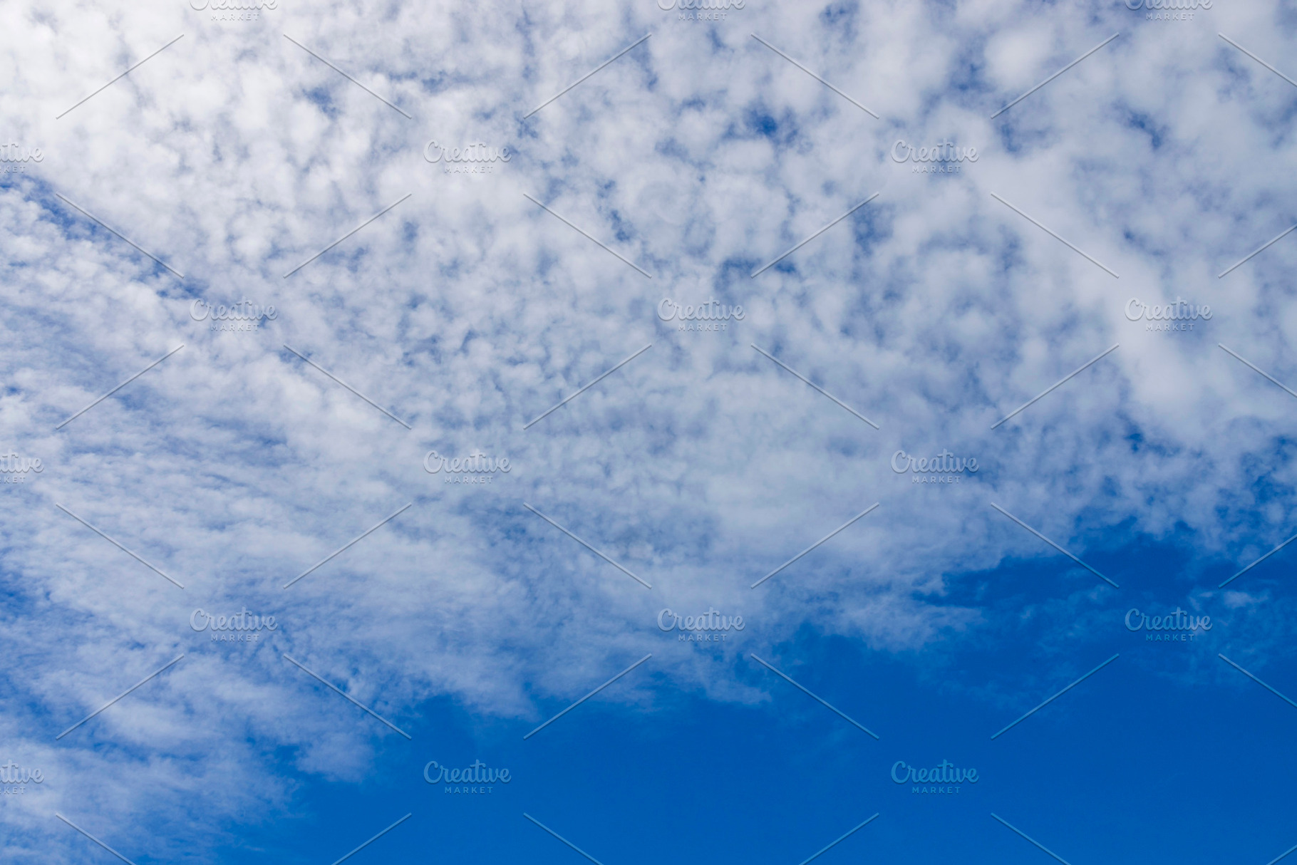 Feathery clouds in the blue sky., a Nature Photo by Imaginarium