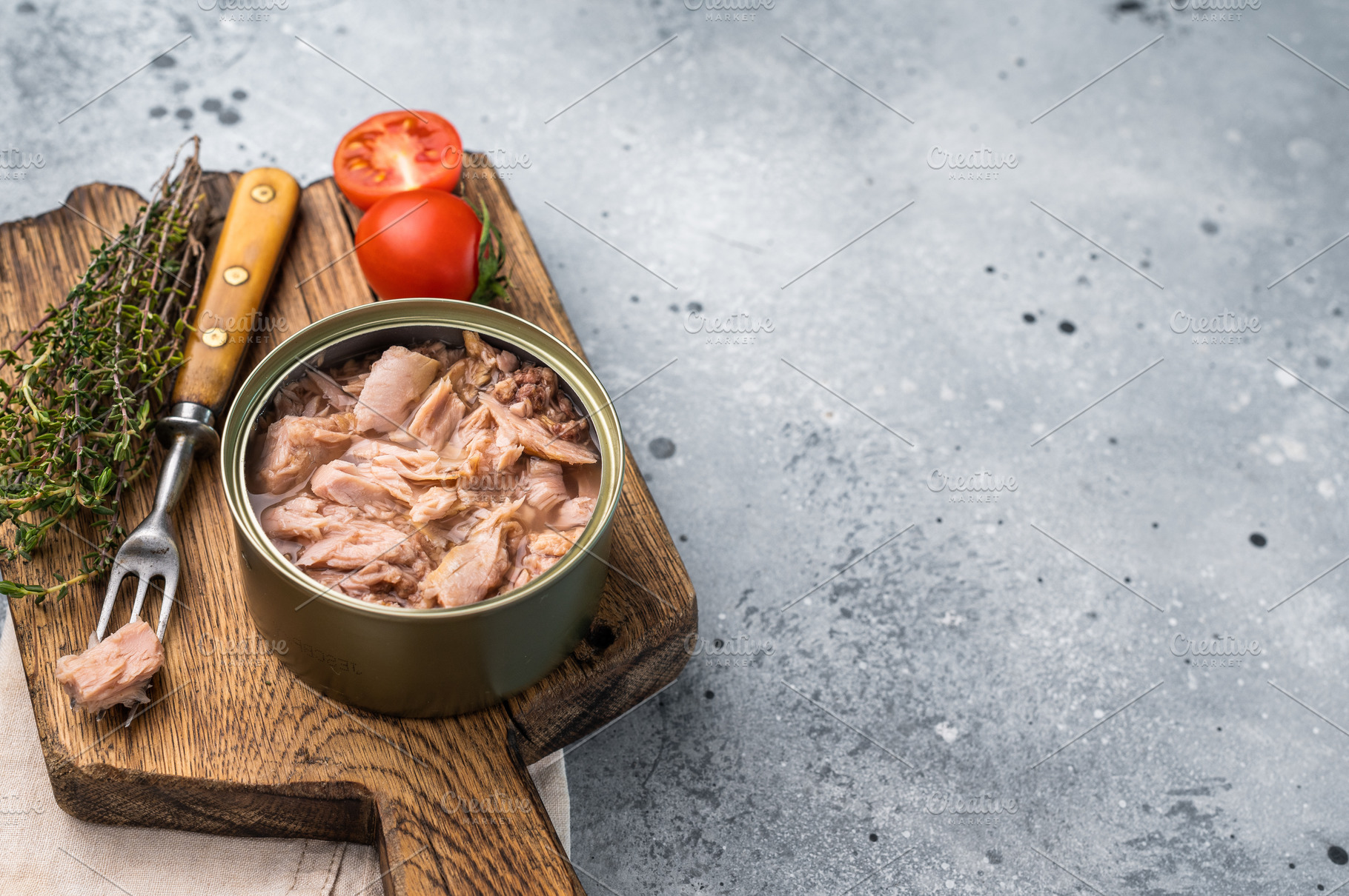 Delicious canned tuna in olive oil, ideal for salads, sandwiches, a Food & Drink Photo by composter-box@mail.ru