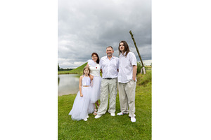 Family posing outdoors in white, a Person Photo by Nenahliadava Design