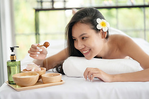 Woman Lying Down on Massage Bed