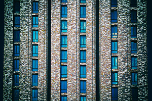 Evil looking front of skyscraper bac