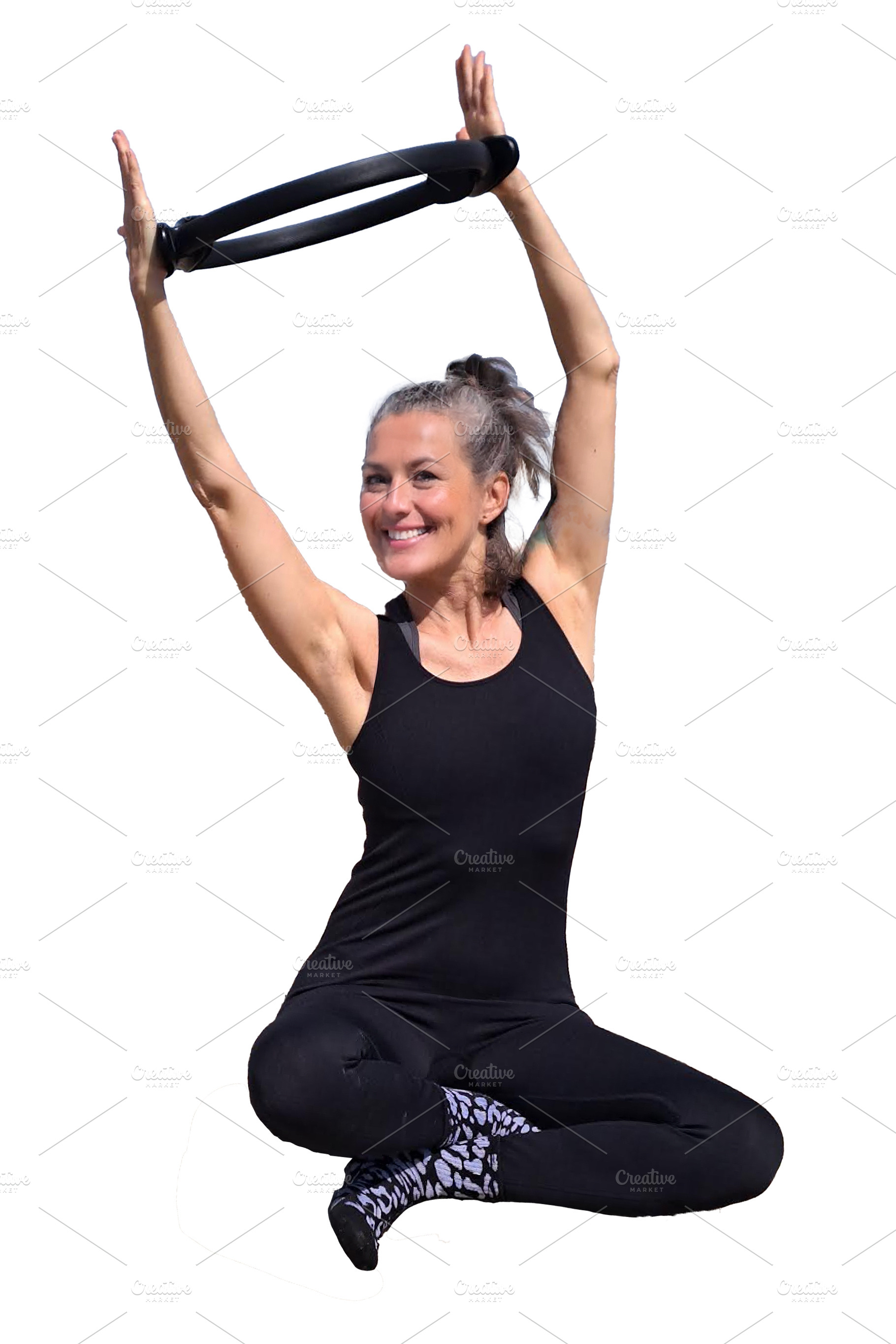 Woman practices pilates on a rugged rocky surface, a Person Photo by DanFLCreativo