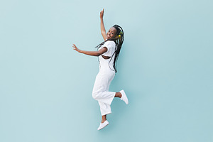 Happy woman in white casual clothes, a Person Photo by Artem Varnitsin