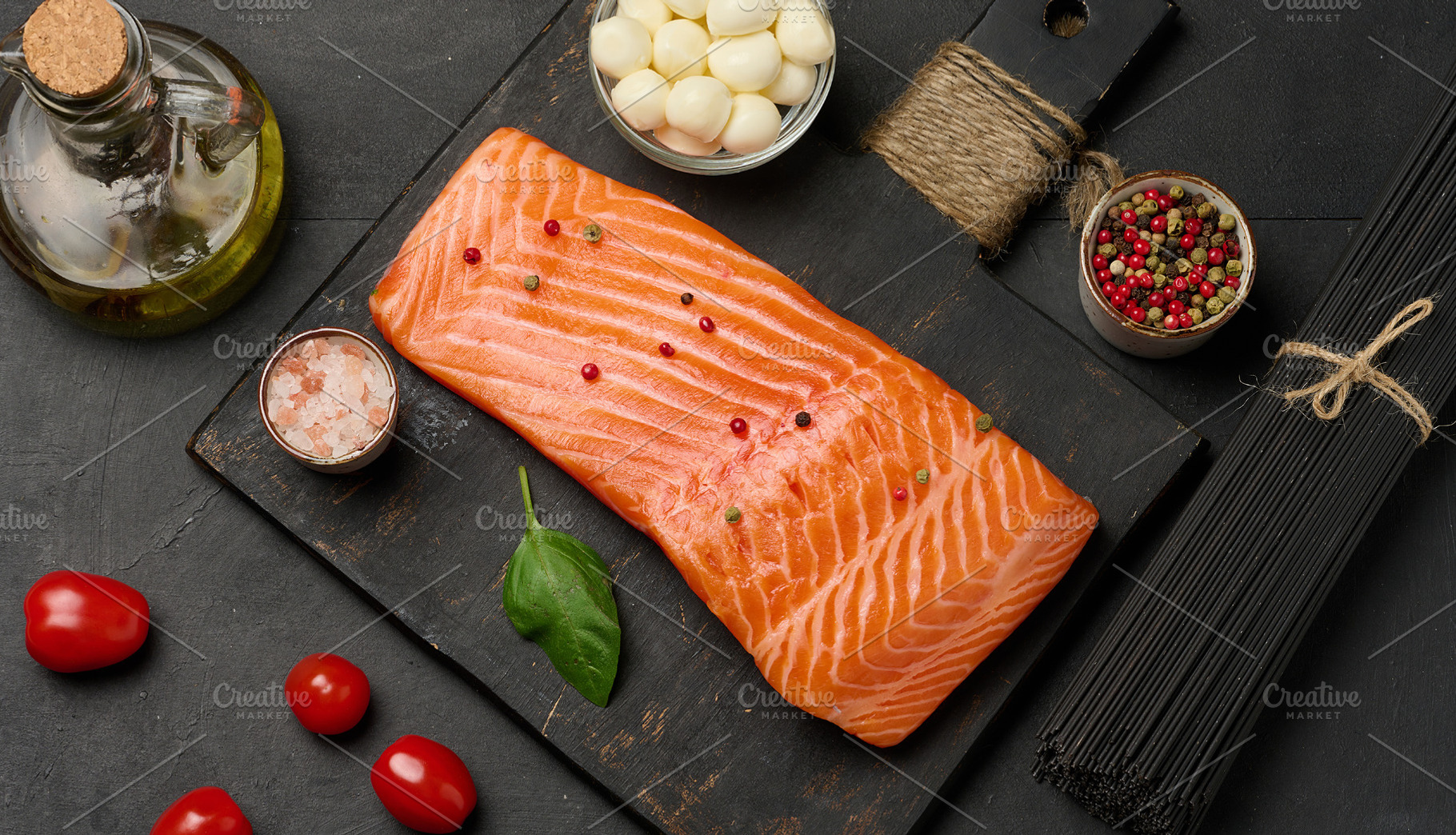 Composition of fresh ingredients salmon piece, cherry tomatoes,, a Food & Drink Photo by ndanko