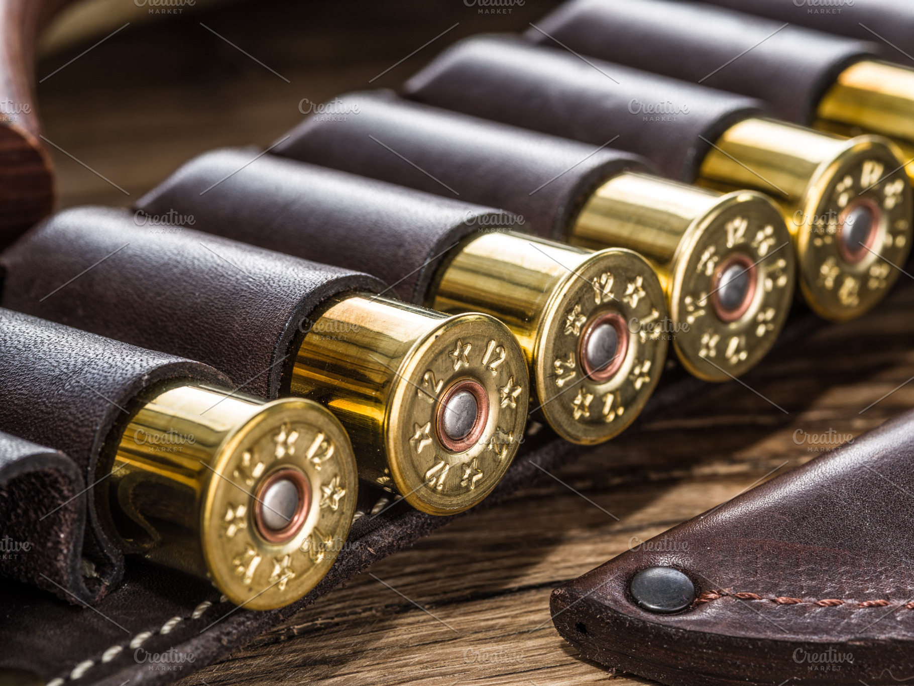 Hunting cartridge for pump shotgun on the wooden table., a Sports & Recreation Photo by Volff