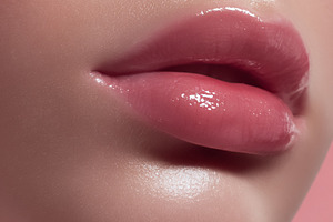 Woman's glossy pink lips and glowing skin close up, showcasing b, a Beauty & Fashion Photo by Studio ANNA