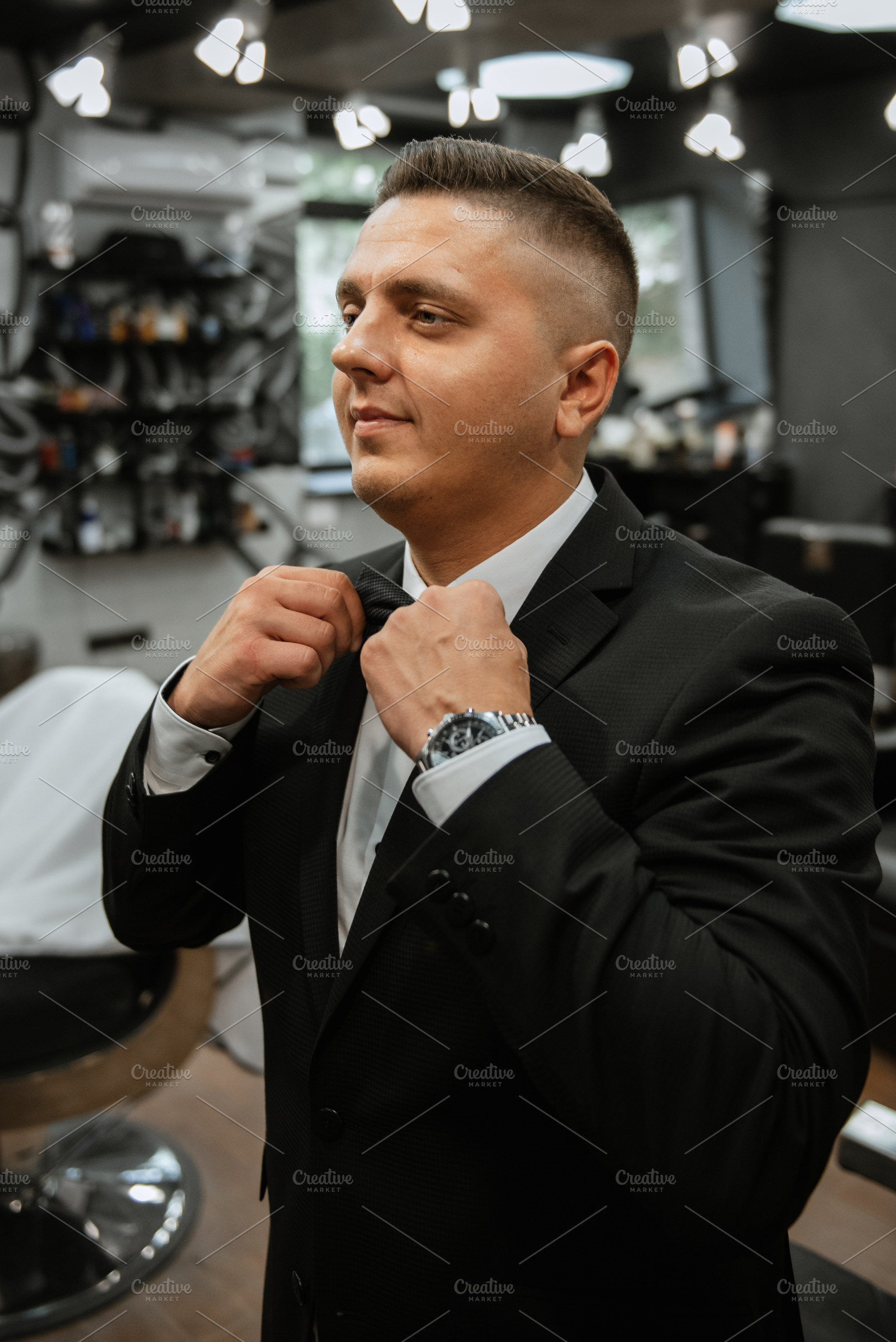 bearded man cutting his beard in the barbershop, a Person Photo by Weddings, People, Travel