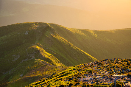 Mountains in fog at sunset in summer. Beautiful landscape, a Nature Photo by den-belitsky
