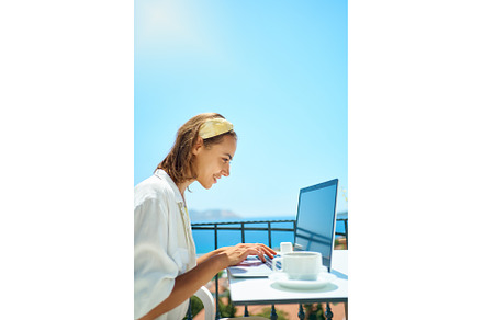 Freelancer woman using laptop, a Person Photo by vitaliymateha photography