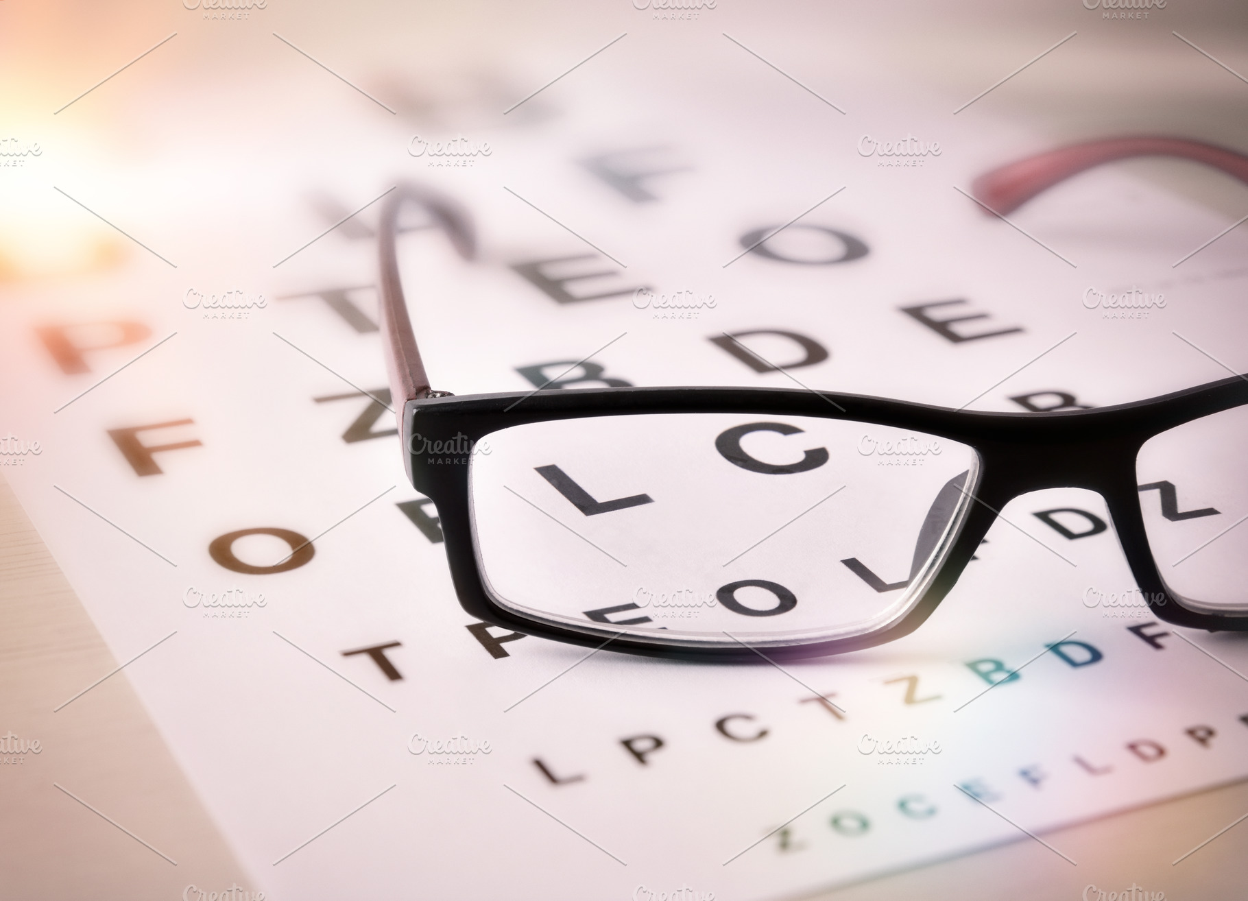 Eyeglasses on optometric chart featuring health, optical, and eye, a Health & Medical Photo by Davizro's Market