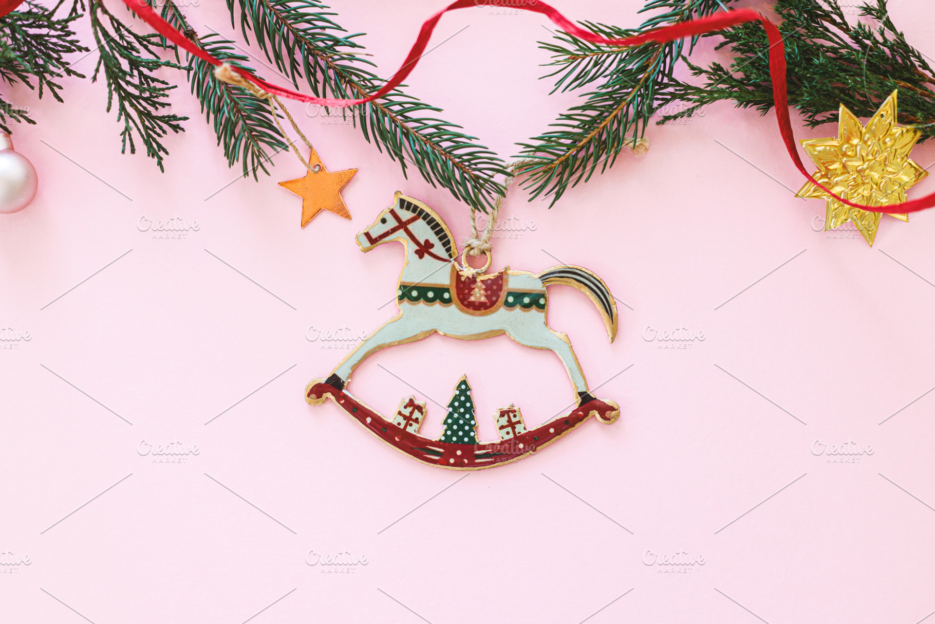 Stylish christmas horse toy flat lay on pink background with gol, a Holiday Photo by Sonjachni