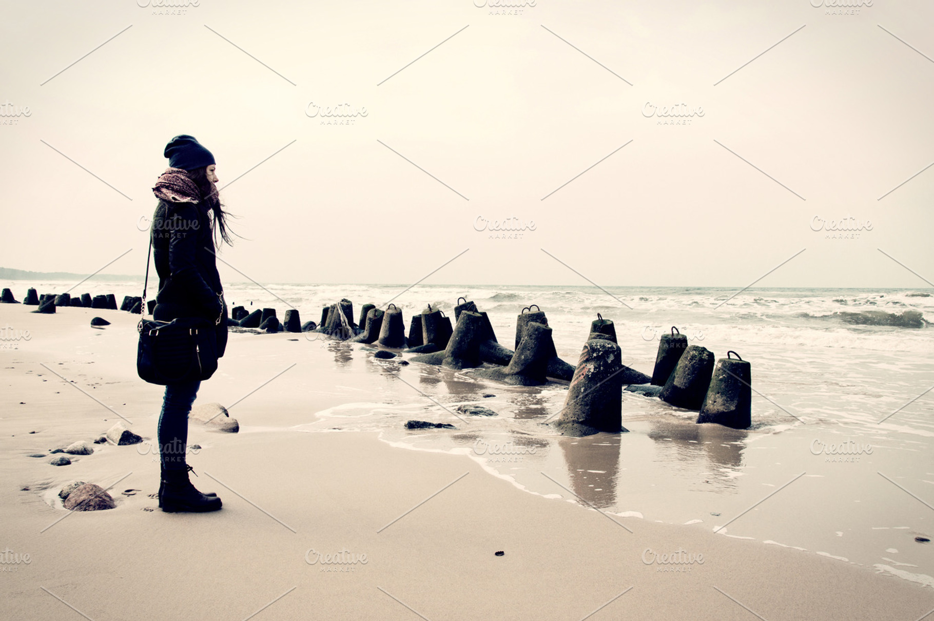 Sad lonely woman on the beach featuring alone, woman, and sad, a Person Photo by Milosz Aniol