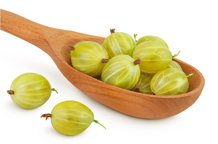 Green gooseberry in wooden spoon, a Food & Drink Photo by NataPhoto