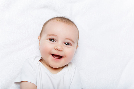 Happy beautiful baby boy in white featuring infant, isolated, and cute