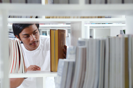 Young man getting books from library stock photo containing academic and books, a School & Education Photo by bastera
