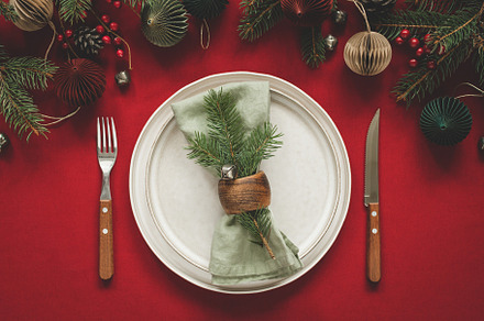 Christmas table setting on red table