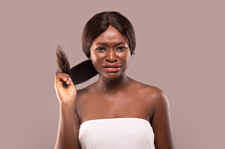 Split Ends. Upset African American Woman Disappointed With Her Damaged Hair, a Background Photo by Prostock-Studio