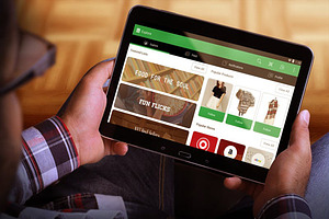 Tablet in Hand Mock Up, an iPad Mockup by Qaleb Studio