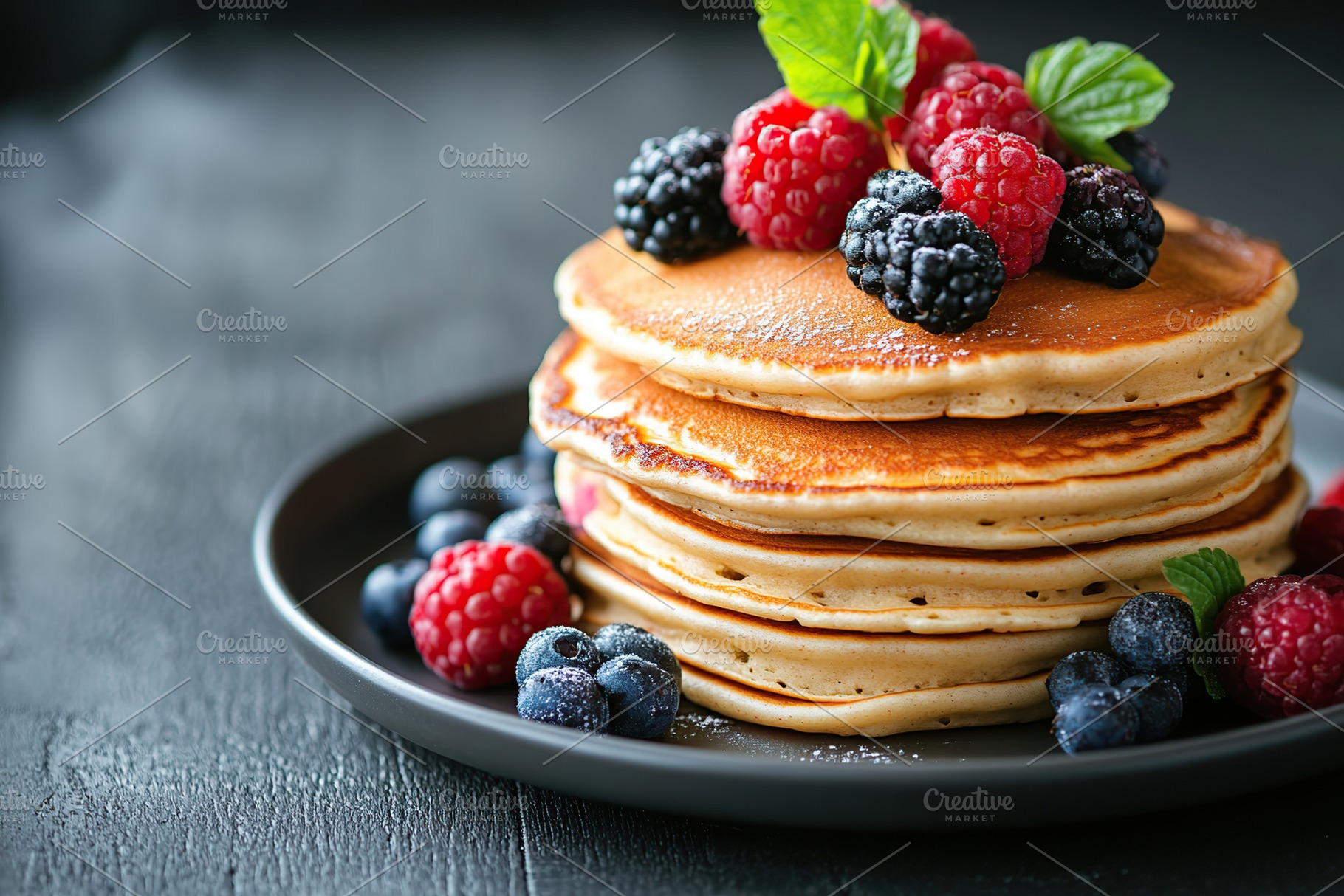 Fluffy pancakes topped with assorted ripe berries and fresh mint leaves for a d, a Food & Drink Photo by AlyaAnd