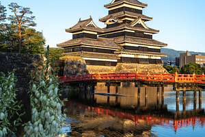 Matsumoto Castle and red bridge at sunset, Japan