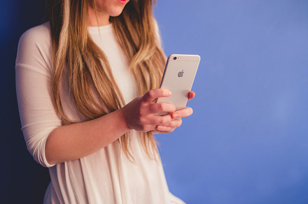 Blonde woman with Iphone