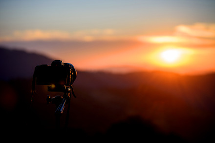 Camera on tripod and photography view with blurred focus mountai, a Nature Photo by Byrdyak
