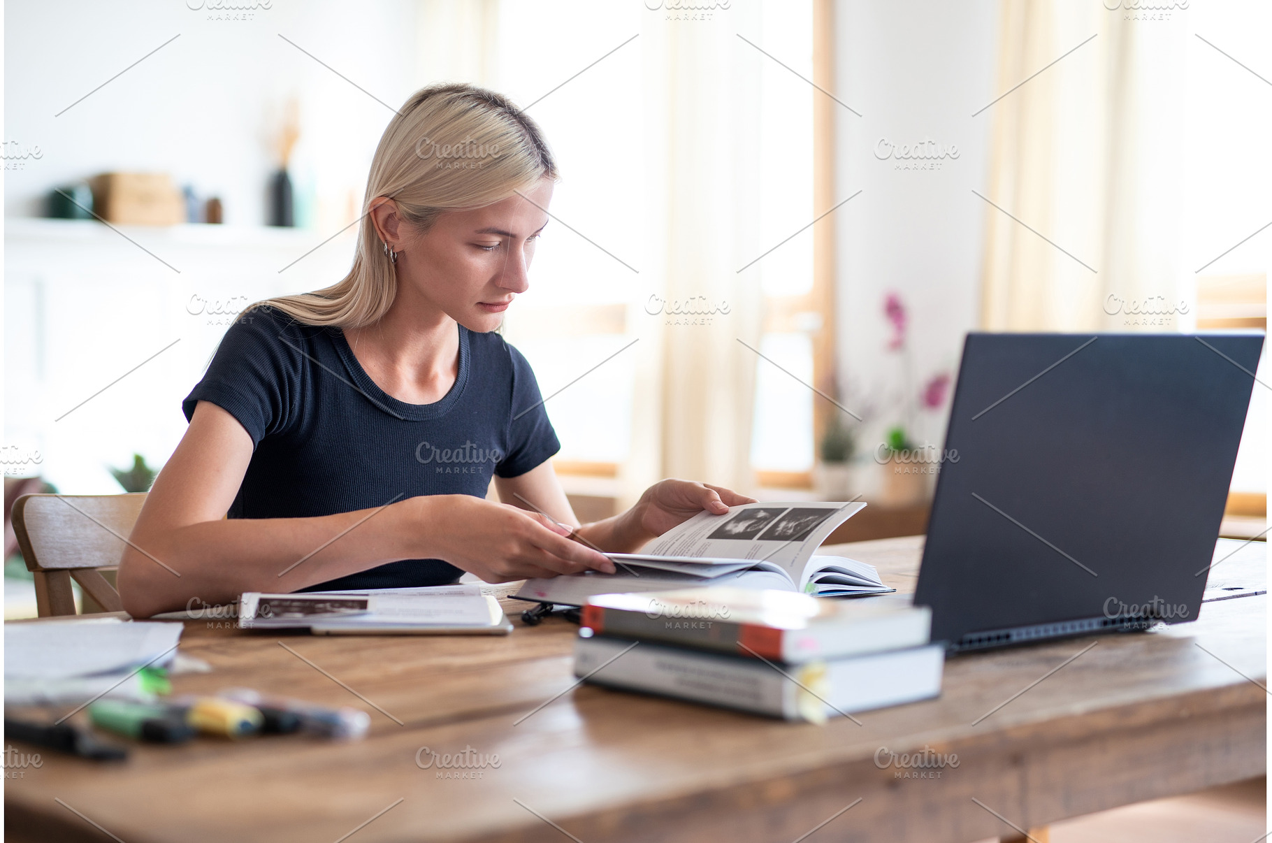 Woman student sitting at table, a School & Education Photo by undrey