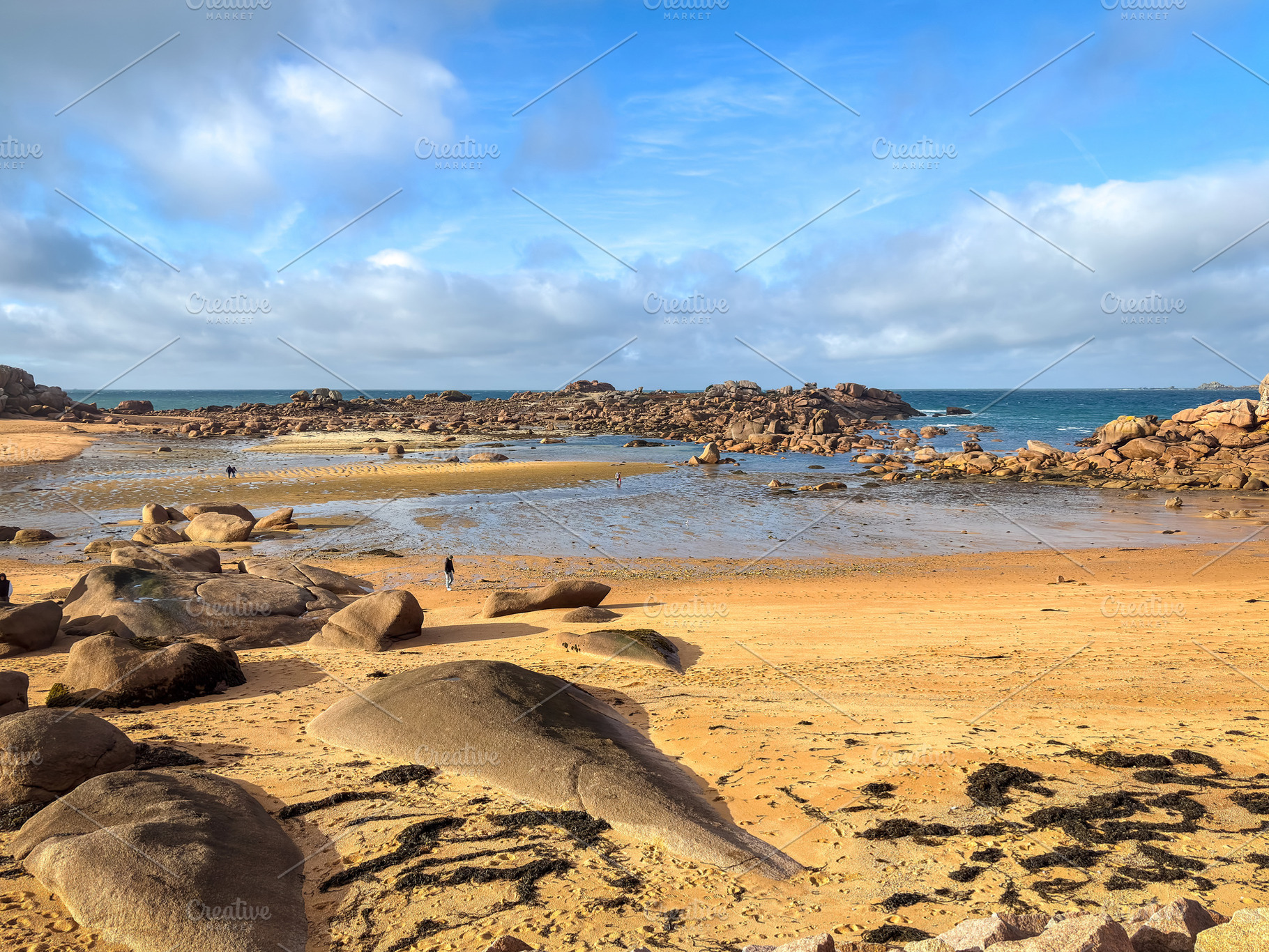 Sandy bay with granite reefs and tidal pools in Tregastel, Franc, a Nature Photo by GoodGoods