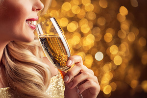 Close-up of woman drinking sparkling wine with background golden, a Holiday Photo by Davizro's Market