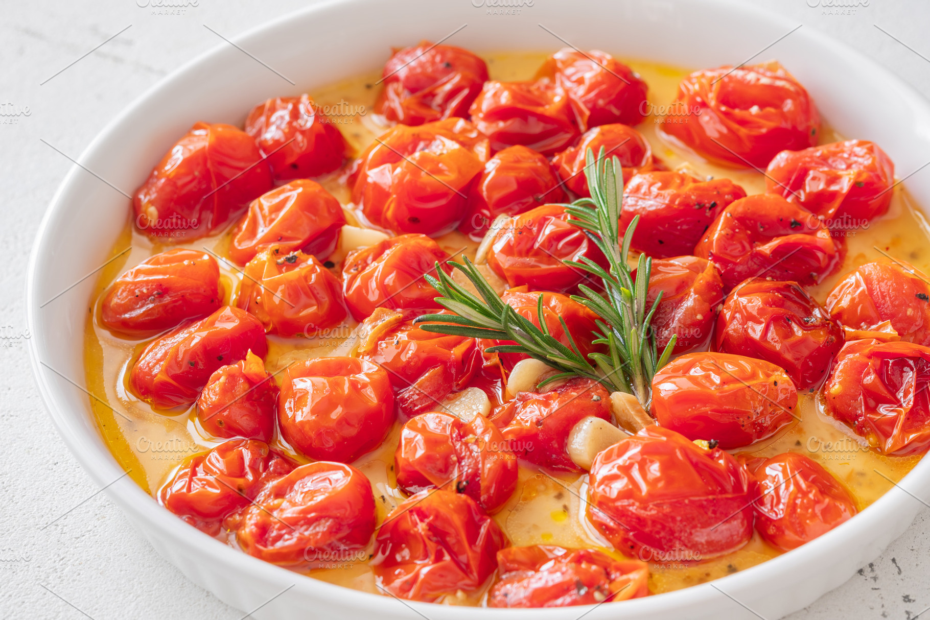Roasted cherry tomatoes with garlic, a Food & Drink Photo by Alexander Prokopenko
