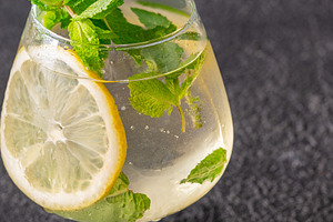 Refreshing Hugo Spritz cocktail with lemon mint ice bubbles and, a Food & Drink Photo by Alexander Prokopenko