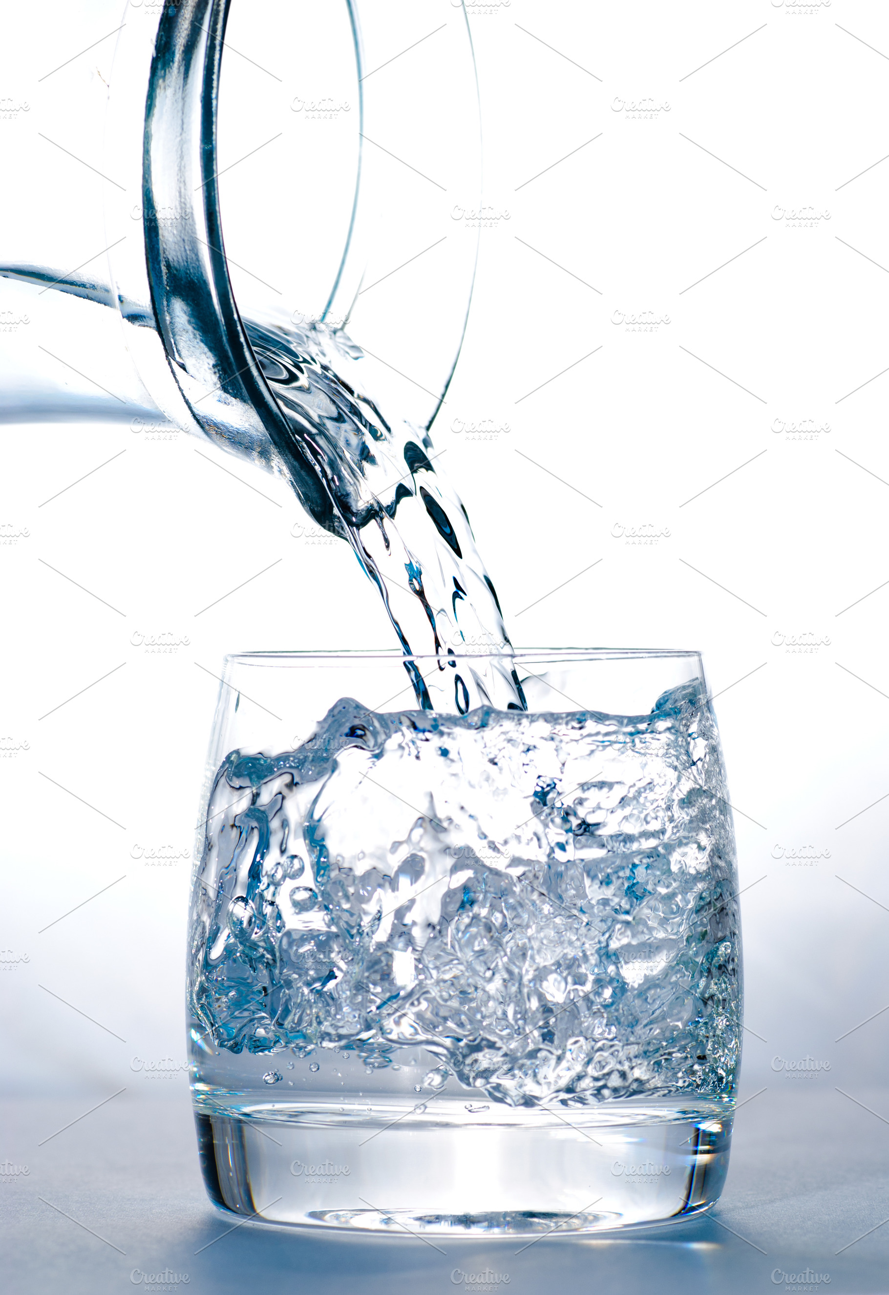 Glass with water and jug containing action, backgrounds, and blue, a Food & Drink Photo by oksix