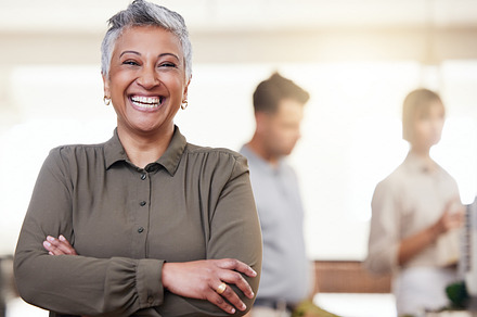 Happy, pride and portrait of a woman with arms crossed in a meeting, seminar or workshop. Smile, leadership and elderly ceo smiling for success of a company at a conference or coworking space, a Photo by Peopleimages.com