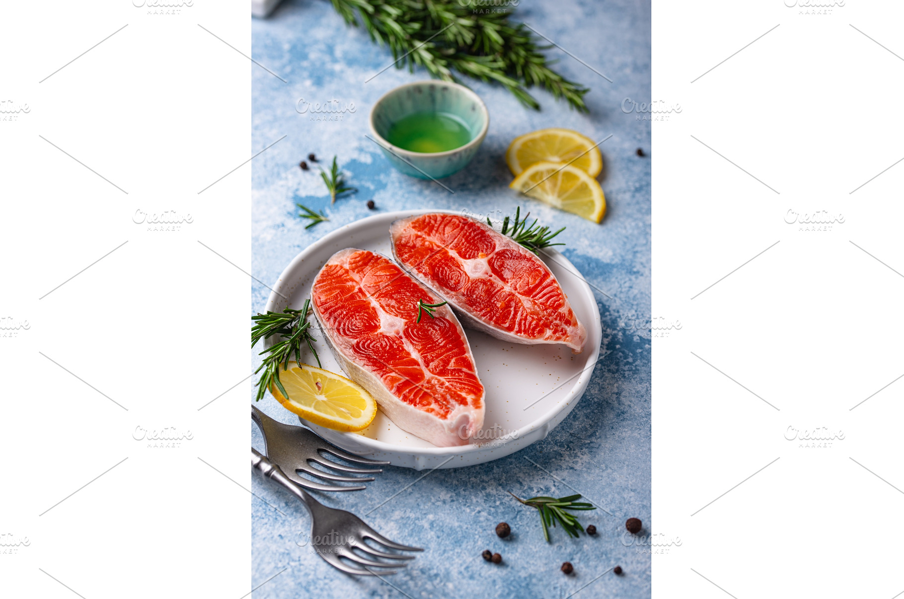 Raw uncooked salmon with rosemary, a Food & Drink Photo by Yulia Furman