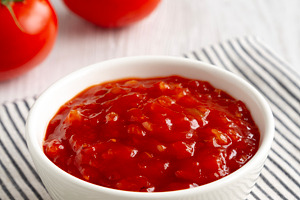 Organic Tomato and Cilantro Salsa in a Bowl, side view., a Food & Drink Photo by LiudmylaChuhunova