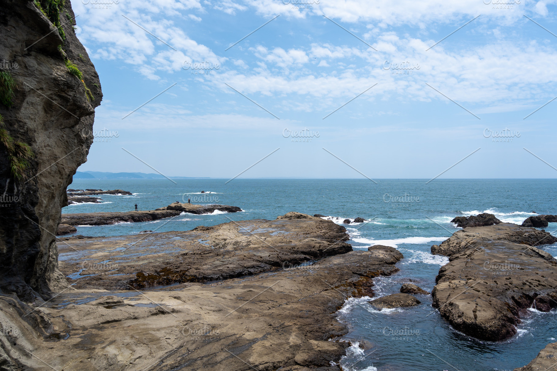 Rocky coastline view of Enoshima Island in Japan, a Nature Photo by GoodGoods