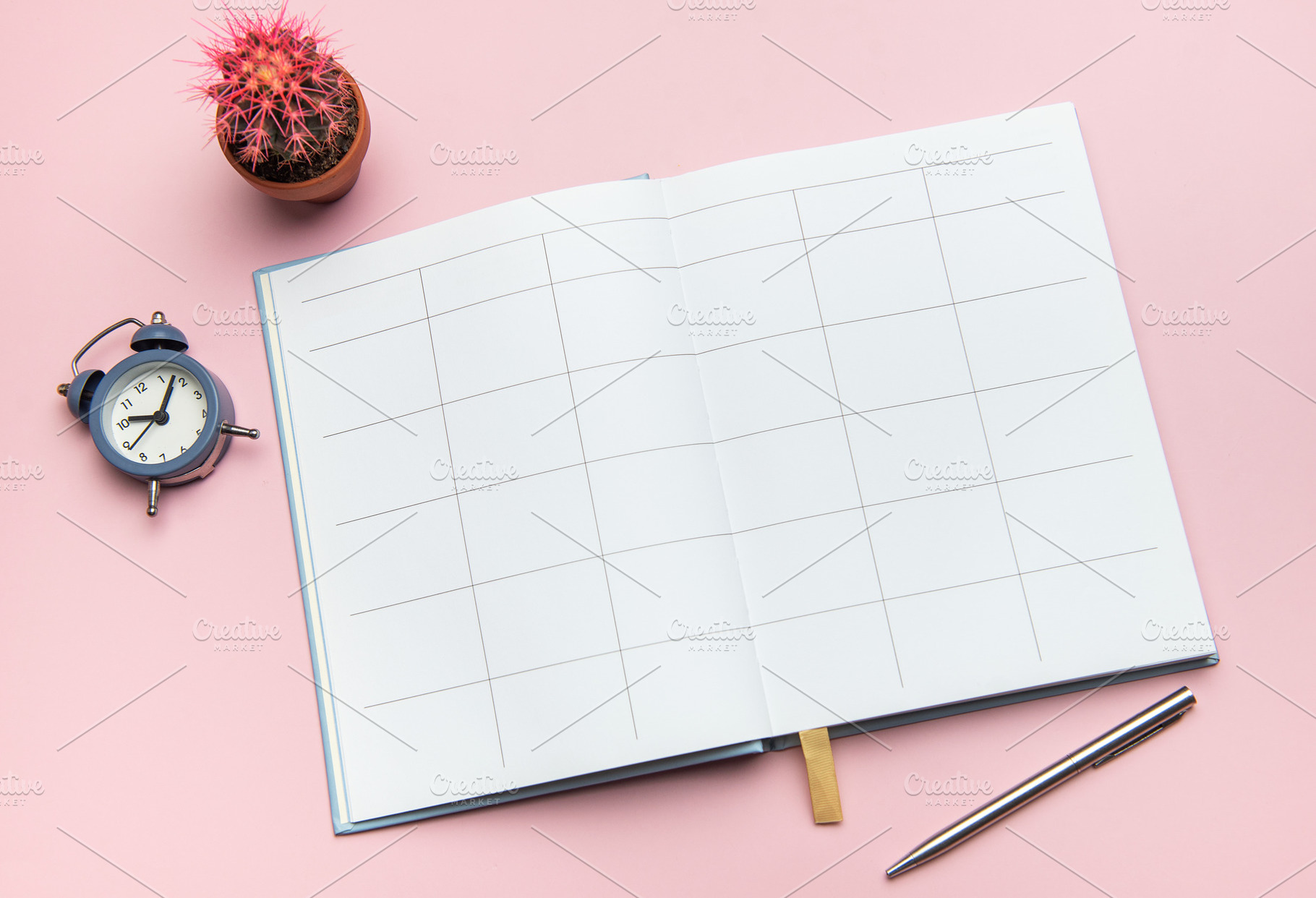 Open notebook, pen, alarm clock, and cactus on pink background s, a Business Photo by Olena Rudo