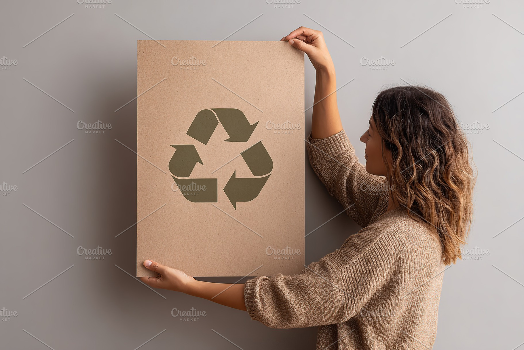 Engaging woman promotes recycling by holding up an eco-friendly poster in minim, a Photo by AlyaAnd