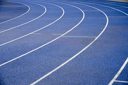 Blue racetracks with white markings containing racetrack, run, and race