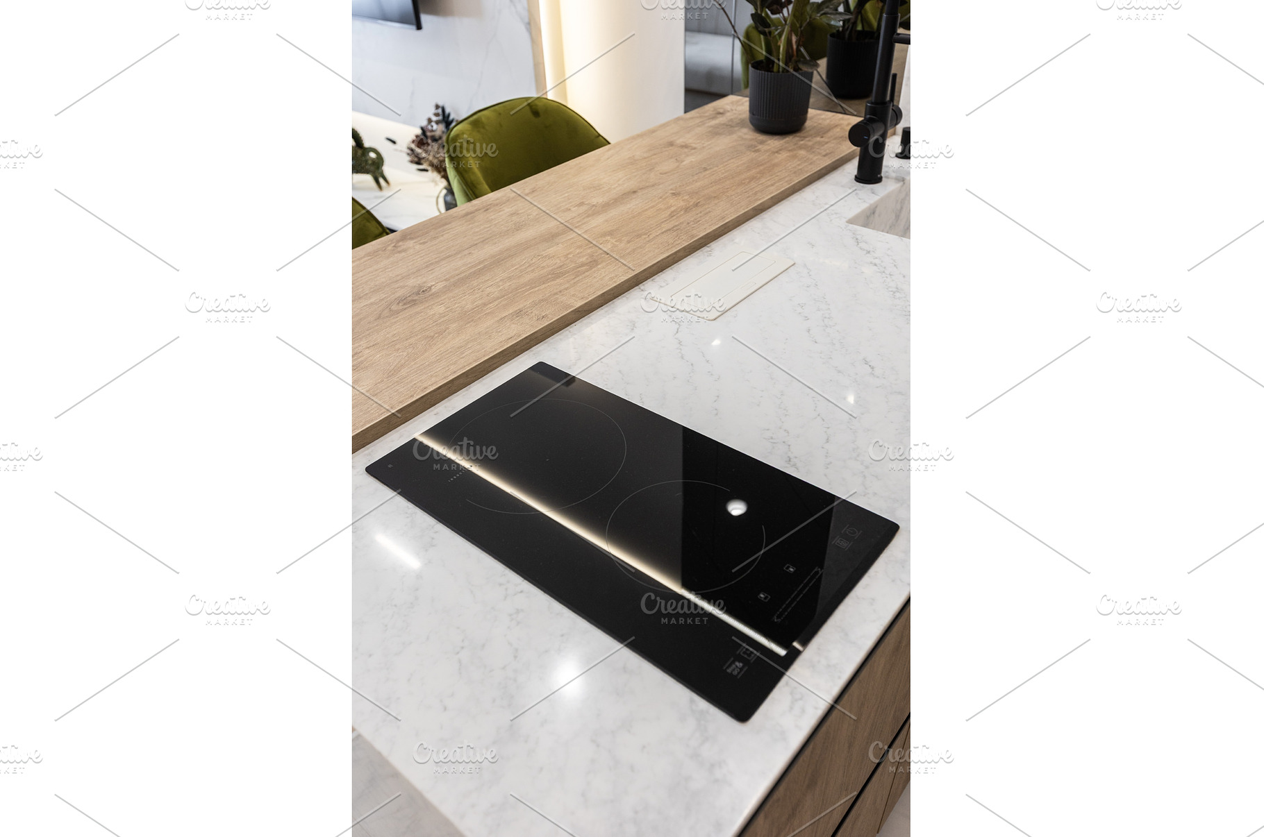 Induction cooktop on marble kitchen, a Technology Photo by wip3out