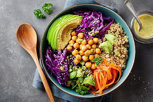 Delicious vegan bowl featuring quinoa, avocado, and purple cabbage with chickpe, a Food & Drink Photo by AlyaAnd