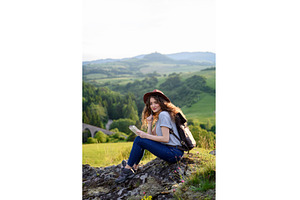 Young tourist woman traveller with, a Person Photo by HalfPoint
