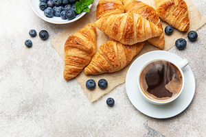 Delicious french breakfast with coffee, croissants and fresh blu, a Food & Drink Photo by Olena Rudo