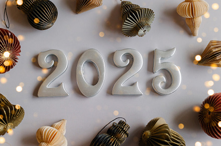 Christmas and New Year card. Number 2025 on holiday background. Christmas light, a Holiday Photo by Anikona