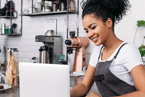 Smiling woman with curly hair, a Business Photo by Artem Varnitsin