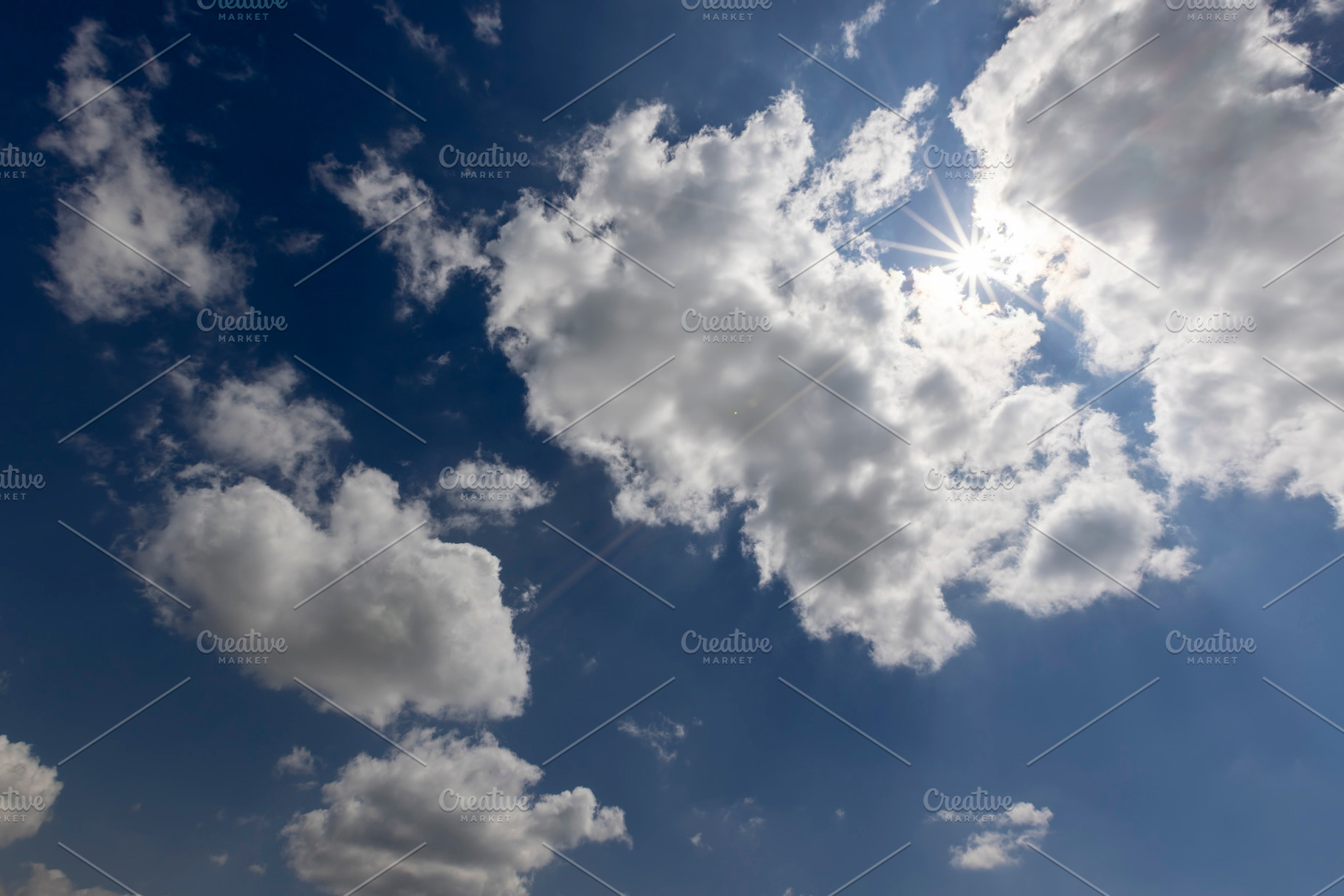 blue sky with clouds in bright weather, sky with clouds illuminated by sun, a Photo by MyPhotos