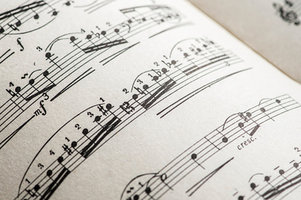 Music notation book containing music, notes, and sheet