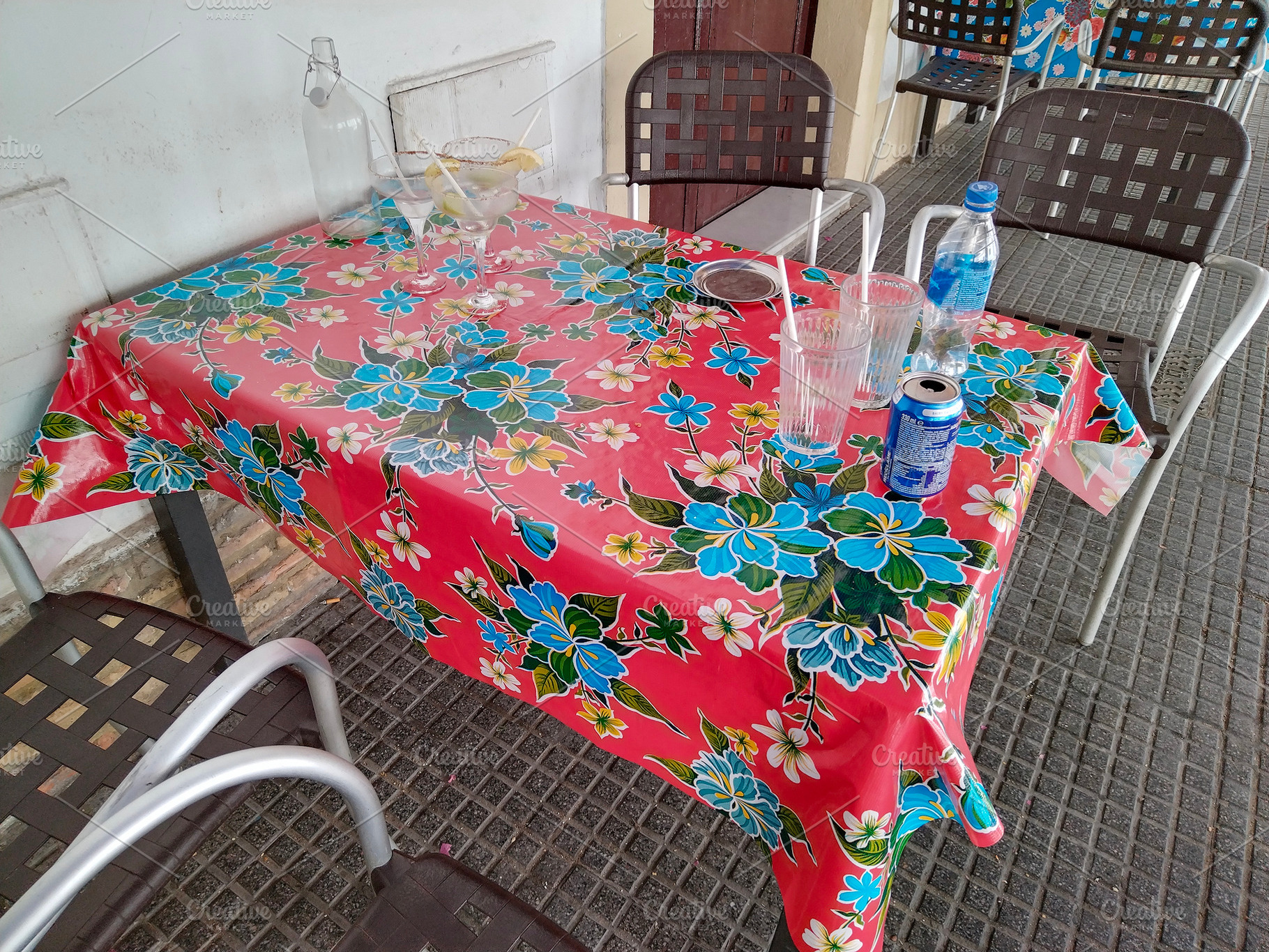 Colorful tablecloth in rustic dining setting, a Food & Drink Photo by DanFLCreativo